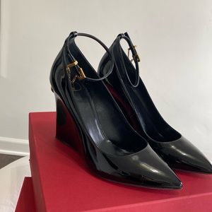 Valentino patent black wedge with ankle strap.